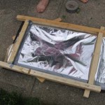 framewithfoilandbacking 150x150 How to Make a $5 Solar Powered Water Heater From Junk Fridge