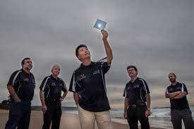 The UOW researchers and the flexible water splitting polymer. Picture credit UOW